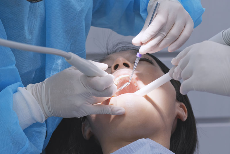 Dental Patient Undergoing Scaling and Root Planning Procedure