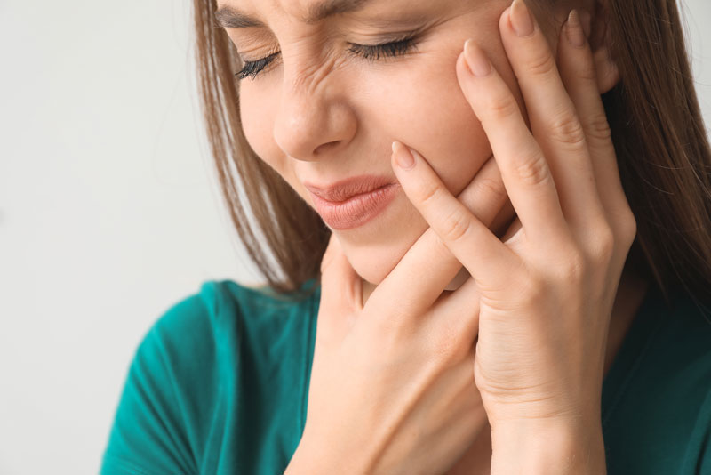 Dental Patient Suffering From TMJ Related Jaw Pain